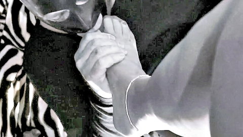 Masked slave adores nyloned feet in passionate worship