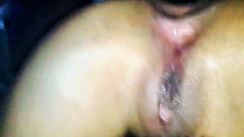 Blurry close-up of mature woman's wet exposed pussy