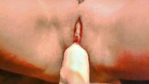 Mature woman masturbating with white dildo inserted in pussy, close-up