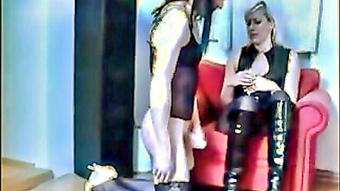 Blonde dominatrix oversees sissy licking cum from exposed ass