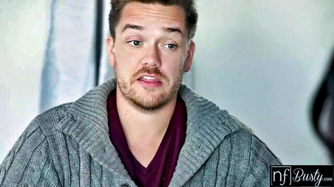 Handsome bearded man in gray sweater, teasing hot student vibe