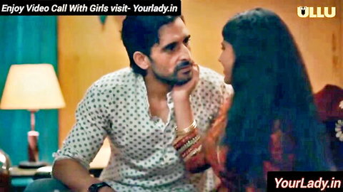 Indian cougar in red top chats intimately with man