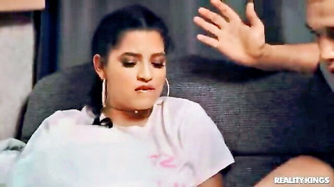 Brunette babe in tight white tee reacts to rough hand slap on couch