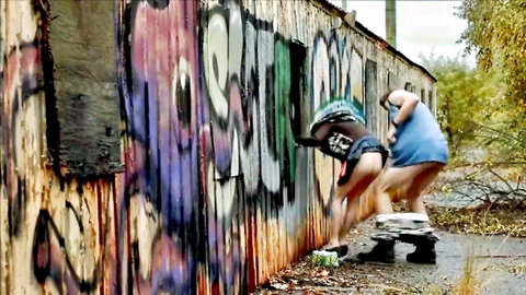 Taryn Manning MILF bent over graffiti wall with exposed ass outdoors