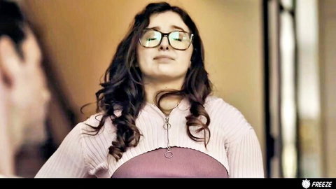 Thick brunette with glasses in pink knit top looks up at stepdaddy