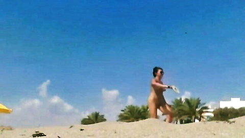 Sassy nude mom walking butt naked on beach, rear view
