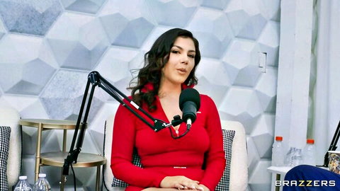 Valentina Nappi on Brazzers Podcast in sexy red dress, seductive interview pose