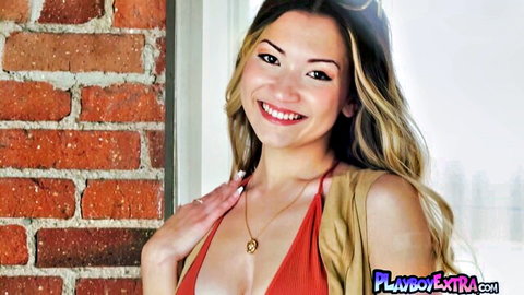 Kelly Lu petite Asian teen teasing nipple piercings in red top