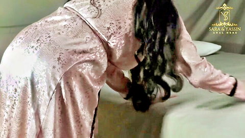 Big ass Arab MILF in pink silk robe bends over bed flashing cheeks seductively