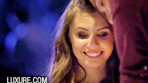 Elle Rose smiles intimately with partner in blue-lit embrace on Luxure birthday scene