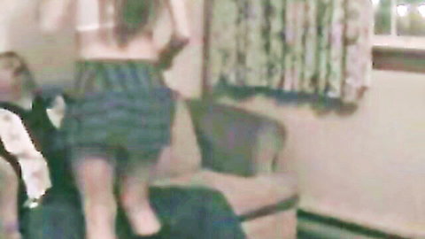Blonde escort in plaid skirt bent over couch for quick sex