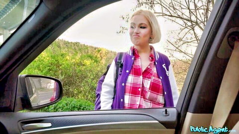 Blonde in purple jacket leans into car for outdoor POV public pickup tease