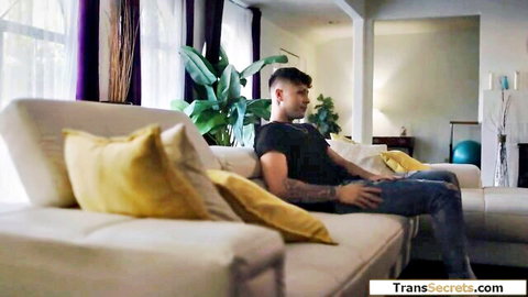 Fit Latin man lounging on couch in black tee and jeans, shemale stepmom preview