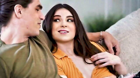Busty brunette Megan Marx in low-cut orange top, flirting with stud in Brazzers scene