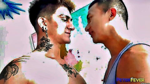Tattooed Asian man with piercings faces muscular Asian hunk in intimate gay encounter