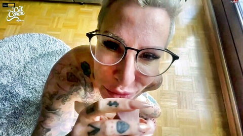 Cat-Coxx tattooed blonde in glasses, topless milking tease