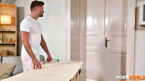Chloe Amour luring scene with muscular man in white holding green toy