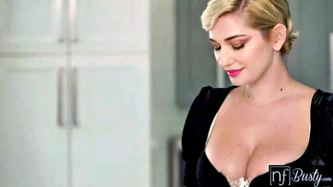 Busty blonde Skye Blue in low-cut black dress, deep cleavage tease