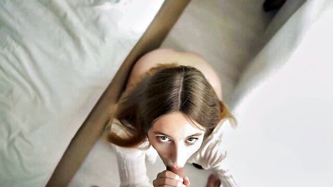 Amateur POV blowjob from stunning brunette in white sweater on bed