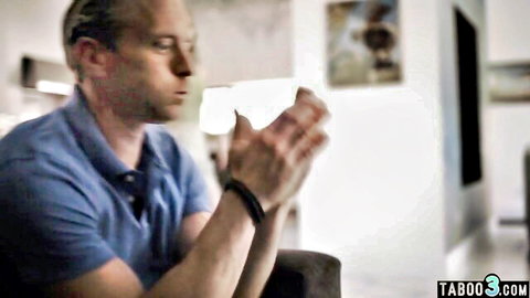 Bald older man in blue shirt clasping hands praying intently in taboo scene