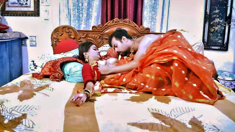 Indian man passionately sucks big exposed tits of saree-clad busty wife on ornate bed