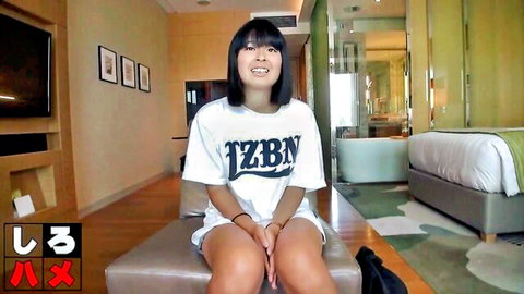 Japanese innocent teenager in white t-shirt and shorts, smiling amateur pose