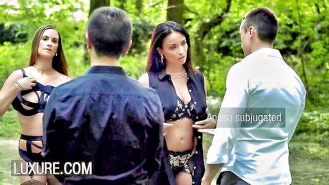 Two lingerie-clad brunettes tease two men in forest for rough outdoor foursome fuck
