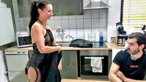 MILF in crotchless black lace lingerie teases man in kitchen with small tits visible