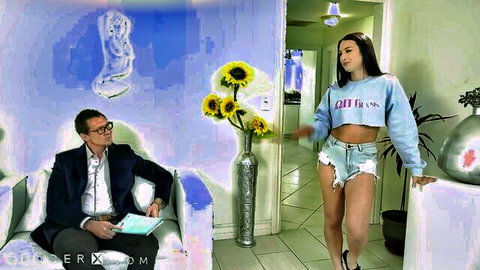 Khloe Kay trans model in cropped sweatshirt and daisy duke shorts, observed by suited man