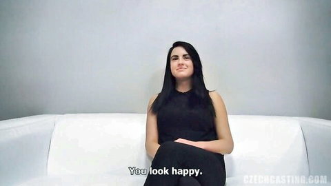 Smiling 18-year-old brunette babe with big natural tits in casting interview