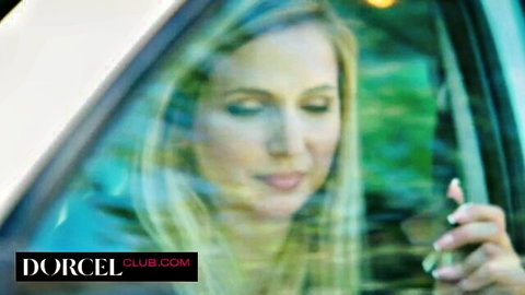 Chloe Duval blonde beauty gazing from car window in seductive pose