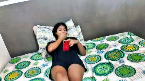 Naughty Colombian stepsister teasing on bed in tight shorts and tank top