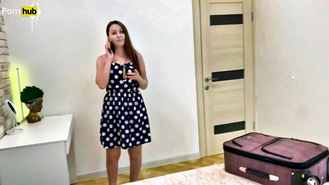 Alina Rai in polka dot dress on phone in hotel, stepmom tease