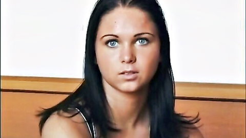 Cristina Bella close-up portrait in sexy tank top, blue eyes and black hair