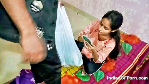 Virgin Indian college girl in pink top and jeans sits on bed, fiance's arm holds sheet nearby