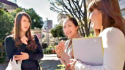 Three Japanese MILFs chatting outdoors in casual wear, JAV escort preview