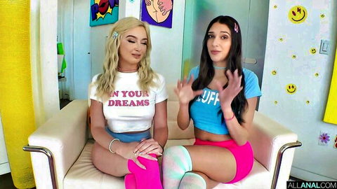 Lexi Lore and Aria Sloane in crop tops and shorts on couch