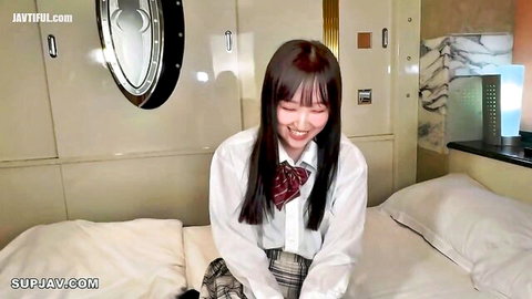 18-year-old Jo Misaki in school uniform smiling on bed