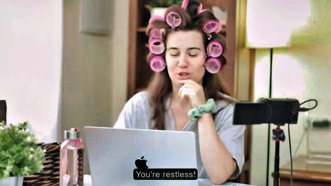 Verashia in curlers during restless live stream at laptop
