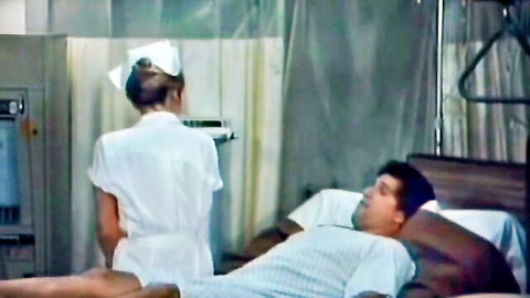 Vintage blonde nurse in short uniform attending to male patient in hospital bed