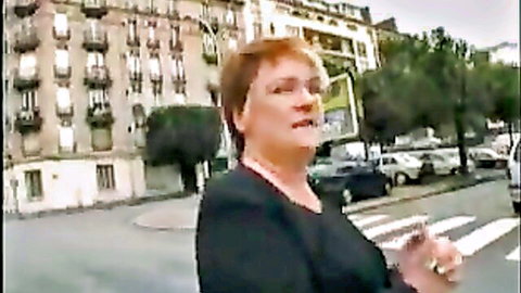 Mature French woman with red hair and glasses outdoors, preview for home anal sex video