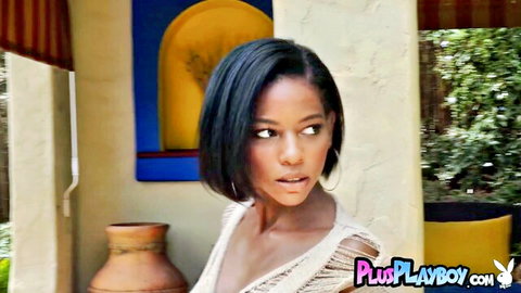 Sensual ebony babe with short hair pouting in sheer lacy top teasing her natural tits