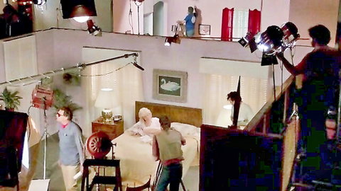 Vintage 1984 porn set: mature actress in bed during Matinee Idol filming