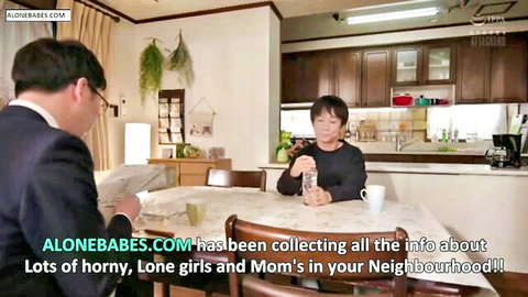 Japanese stepmom in black sweater chats with suited stepson at kitchen table, JAV incest tease