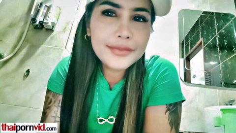 Amateur Thai teen Lily Koh smiling in green top, bathroom tease
