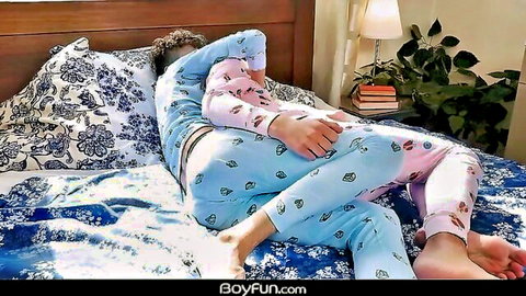 Zayne Bright gay twink lounging in cute blue pink pajamas on bed