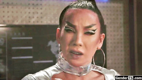 Stunning Asian trans beauty in shiny silver sci-fi choker outfit with dramatic eye makeup closeup