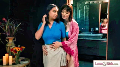 Brunette stepmom in pink robe hugs mistaken gf in blue top and skirt
