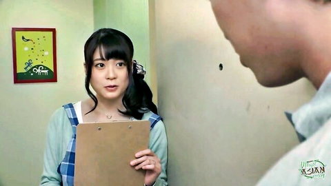 Japanese babe in plaid skirt and cardigan holds clipboard, teasing man in JAV scene