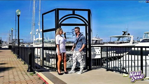 Nikki Sexx in sexy white mini dress flirting at marina with stud